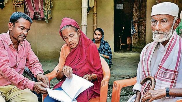Khaibar Ali (43) along with his father Jahur Ali (73) and mother Sarifa Bebi (54) year old, check the names in the recently published final list of the National Register of Citizens (NRC), at Gorbhetar . (HT FILE) Khaibar Ali (43) along with his father Jahur Ali (73) and mother Sarifa Bebi (54) year old, check the names in the recently published final list of the National Register of Citizens (NRC), at Gorbhetar . (HT FILE)