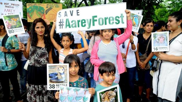 Citizens hold a protest march at Aarey Milk Colony on Saturday against the decision to cut trees for the Metro-3 project.(HT Photo) Citizens hold a protest march at Aarey Milk Colony on Saturday against the decision to cut trees for the Metro-3 project.(HT Photo)