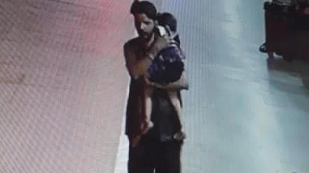 The three-year-old was sleeping with her mother at the railway station on July 25 when she was picked up by Rinku Sahu, seen here in CCTV footage, walking away with the sleeping girl in his arms. (Credit : Railway Police / Screengrab) The three-year-old was sleeping with her mother at the railway station on July 25 when she was picked up by Rinku Sahu, seen here in CCTV footage, walking away with the sleeping girl in his arms. (Credit : Railway Police / Screengrab)