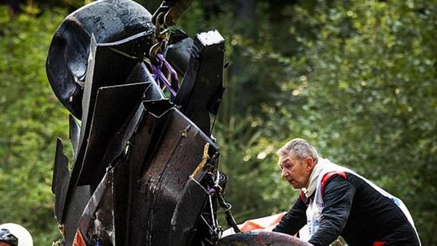 An official looks at the wreckage after the crash at a Formula 2 race.(Getty Image) An official looks at the wreckage after the crash at a Formula 2 race.(Getty Image)
