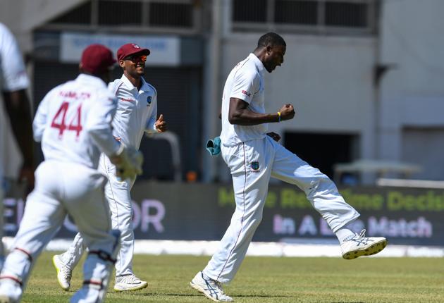 Jason Holder (R) and Kraigg Brathwaite (2L) of West Indies celebrate the dismissal of Rishabh Pant of India during day 2 of the 2nd Test. (AFP) Jason Holder (R) and Kraigg Brathwaite (2L) of West Indies celebrate the dismissal of Rishabh Pant of India during day 2 of the 2nd Test. (AFP)