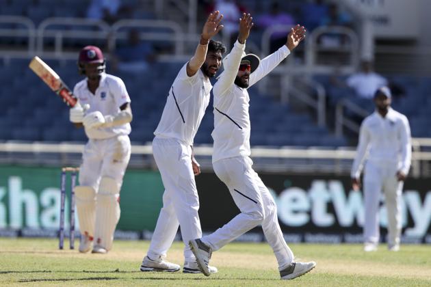 India's Jasprit Bumrah and Ravindra Jadeja, right, appeal for the wicket of Kraigg Brathwaite during day two of the second Test. (AP) India's Jasprit Bumrah and Ravindra Jadeja, right, appeal for the wicket of Kraigg Brathwaite during day two of the second Test. (AP)