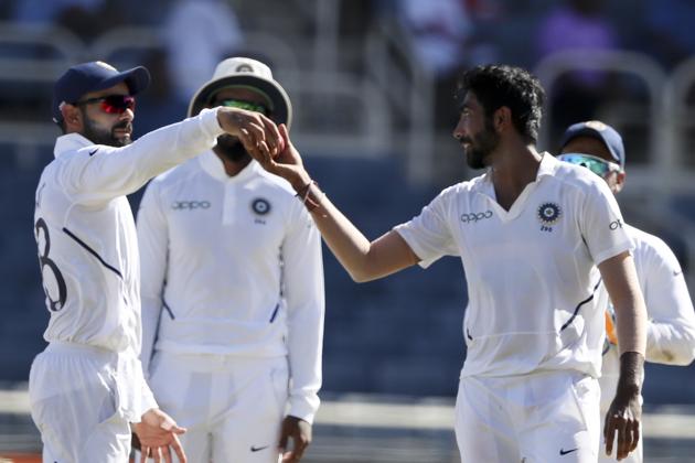 India's Jasprit Bumrah receives the ball from captain Virat Kohli after taking the wicket of Kraigg Brathwaite during day two of the second Test (AP) India's Jasprit Bumrah receives the ball from captain Virat Kohli after taking the wicket of Kraigg Brathwaite during day two of the second Test (AP)