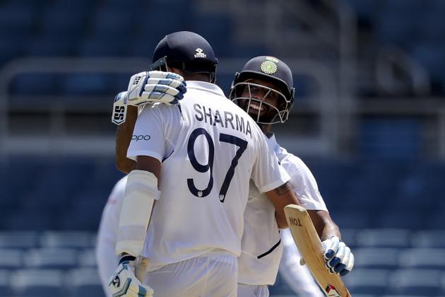 India's Ishant Sharma celebrates with teammate Hanuma Vihari scoring a half century against West Indies during day two of the second Test. (AP) India's Ishant Sharma celebrates with teammate Hanuma Vihari scoring a half century against West Indies during day two of the second Test. (AP)