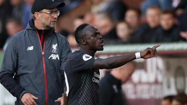 Liverpool's Sadio Mane reacts after being substituted off as manager Juergen Klopp looks on.(Action Images via Reuters)