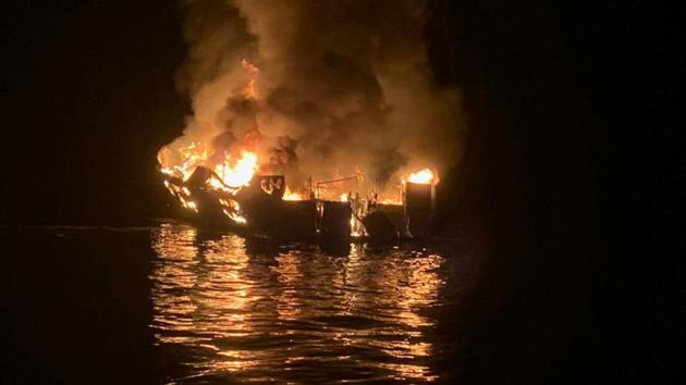 A 75-foot (23-meter) vessel burns during a rescue operation off Santa Cruz Island, California, U.S. September 2, 2019. (VIA REUTERS) A 75-foot (23-meter) vessel burns during a rescue operation off Santa Cruz Island, California, U.S. September 2, 2019. (VIA REUTERS)