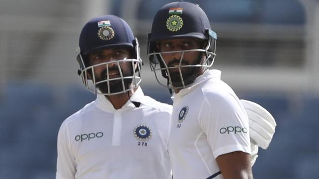 India's Ajinkya Rahane, left, is congratulated by teammate India's Hanuma Vihari.(AP) India's Ajinkya Rahane, left, is congratulated by teammate India's Hanuma Vihari.(AP)