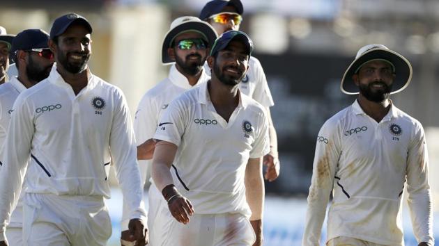 India's Jasprit Bumrah, center, leaves the field with teammates.(AP)