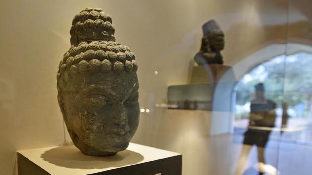 A sculpture of the head of Gautam Buddha, the founder of Buddhism, on display at the gallery. The gallery is curated by the Archaeological Survey of India (ASI). Most of the objects retrieved are through the ministry of external affairs and other law enforcement agencies and are stored at the ASI’s central antiquity collection (CAC) or other authorities. (Biplov Bhuyan / HT Photo) A sculpture of the head of Gautam Buddha, the founder of Buddhism, on display at the gallery. The gallery is curated by the Archaeological Survey of India (ASI). Most of the objects retrieved are through the ministry of external affairs and other law enforcement agencies and are stored at the ASI’s central antiquity collection (CAC) or other authorities. (Biplov Bhuyan / HT Photo)
