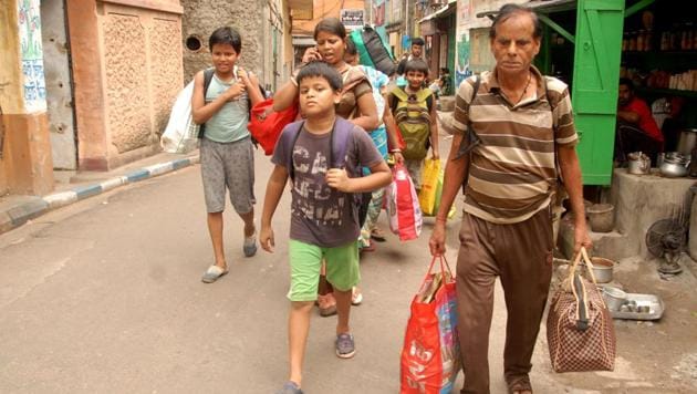 Residents of Bowbazar in central Kolkata evacuating their houses after they developed cracks,(Sourced)