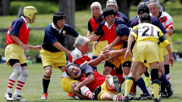 Players of Fuwaku Rugby Club play against another club team during a match in Kumagaya. The country, though, has long been in the top 10 in the world for the number of rugby players with more than 1,20,000 at the last World Rugby census. Fuwaku’s General Manager Mitsuaki Okajima estimates there are around 10,000 veteran rugby players currently playing at clubs across Japan and his club alone has 300 players. (Kim Kyung-Hoon / REUTERS) Players of Fuwaku Rugby Club play against another club team during a match in Kumagaya. The country, though, has long been in the top 10 in the world for the number of rugby players with more than 1,20,000 at the last World Rugby census. Fuwaku’s General Manager Mitsuaki Okajima estimates there are around 10,000 veteran rugby players currently playing at clubs across Japan and his club alone has 300 players. (Kim Kyung-Hoon / REUTERS)