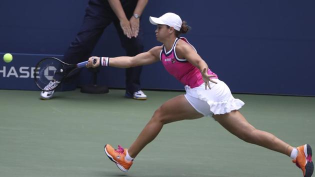 Ashleigh Barty, of Australia, stretches for a return against Qiang Wang, of China.(AP)