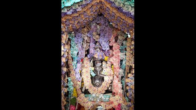 A Lord Ganesha idol decorated by about Rs 10 lakh rupees at a temple in Kanchipuram. Various festival organising committees execute out of the box decorations for idols and pandals which become major attraction points for the devotees. (PTI) A Lord Ganesha idol decorated by about Rs 10 lakh rupees at a temple in Kanchipuram. Various festival organising committees execute out of the box decorations for idols and pandals which become major attraction points for the devotees. (PTI)