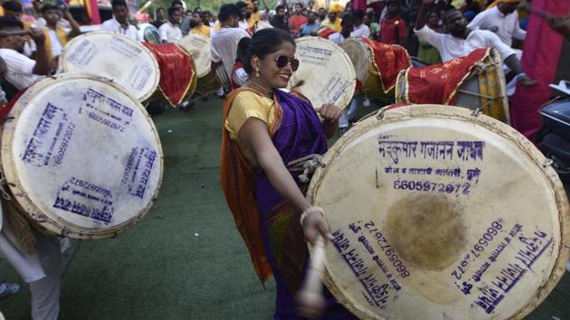 Artists from Sankalp Band perform during a Ganesh Chaturthi procession organised by Delhi Ka Raja Organizing Committee, at Kirti Nagar in New Delhi. Ganesh Chaturthi is believed to mark the birth anniversary of the deity and is celebrated on the fourth day (chaturthi) of the Hindu calendar month of Bhadrapada. (Sonu Mehta / HT Photo) Artists from Sankalp Band perform during a Ganesh Chaturthi procession organised by Delhi Ka Raja Organizing Committee, at Kirti Nagar in New Delhi. Ganesh Chaturthi is believed to mark the birth anniversary of the deity and is celebrated on the fourth day (chaturthi) of the Hindu calendar month of Bhadrapada. (Sonu Mehta / HT Photo)