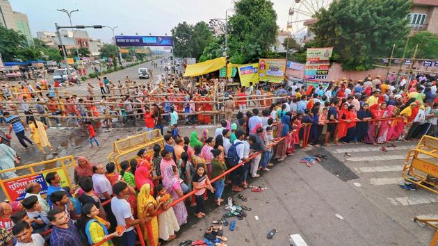 Devotees wait to offer prayers at the Moti Dungri temple, on the occasion of the Ganesh Chaturthi in Jaipur. During Ganeshotsav, devotees throng pandals and feast on sweets such as modak, which is considered Ganesha’s favourite, lending him the additional title of ‘Modakpriya’. (PTI) Devotees wait to offer prayers at the Moti Dungri temple, on the occasion of the Ganesh Chaturthi in Jaipur. During Ganeshotsav, devotees throng pandals and feast on sweets such as modak, which is considered Ganesha’s favourite, lending him the additional title of ‘Modakpriya’. (PTI)