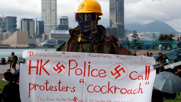 A protester holds a banner during a general strike at Tamar Park in front of the government buildings in Hong Kong, China September 3, 2019. (Reuters) A protester holds a banner during a general strike at Tamar Park in front of the government buildings in Hong Kong, China September 3, 2019. (Reuters)