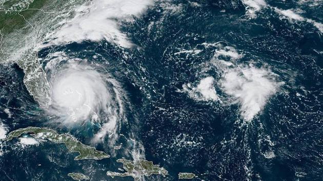 GOES-16 satellite image taken on September 02, shows Hurricane Dorian churning over Bahamas. Bahamian officials said they received a “tremendous” number of calls from people in flooded homes. One radio station said it received more than 2,000 distress messages, including reports of a 5-month-old baby stranded on a roof and a woman with six grandchildren who cut a hole in a roof to escape rising floodwaters. At least two designated storm shelters flooded. (NOAA / AP) GOES-16 satellite image taken on September 02, shows Hurricane Dorian churning over Bahamas. Bahamian officials said they received a “tremendous” number of calls from people in flooded homes. One radio station said it received more than 2,000 distress messages, including reports of a 5-month-old baby stranded on a roof and a woman with six grandchildren who cut a hole in a roof to escape rising floodwaters. At least two designated storm shelters flooded. (NOAA / AP)