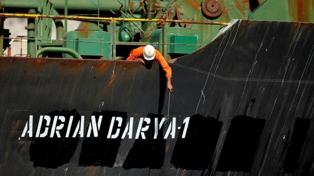 A crew member takes pictures with a mobile phone on Iranian oil tanker Adrian Darya 1 as it sits anchored after the Supreme Court of the British territory lifted its detention order, in the Strait of Gibraltar. (Photo: Reuters) A crew member takes pictures with a mobile phone on Iranian oil tanker Adrian Darya 1 as it sits anchored after the Supreme Court of the British territory lifted its detention order, in the Strait of Gibraltar. (Photo: Reuters)