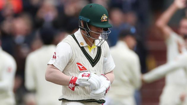 Australia's David Warner walks off as England players celebrate the wicket.(Action Images via Reuters)