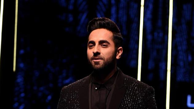 Ayushmann Khurrana presents a creation by the designer brand Rohit Gandhi and Rahul Khanna at Lakmé Fashion Week.(AFP)