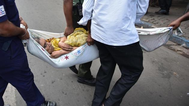An elderly ill lady is being carried out from one damaged house at Bowbazar area. Several buildings in the congested area have developed cracks, leaving hundreds homeless. Some 375 people have been shifted since Monday. (Samir Jana / HT Photo) An elderly ill lady is being carried out from one damaged house at Bowbazar area. Several buildings in the congested area have developed cracks, leaving hundreds homeless. Some 375 people have been shifted since Monday. (Samir Jana / HT Photo)