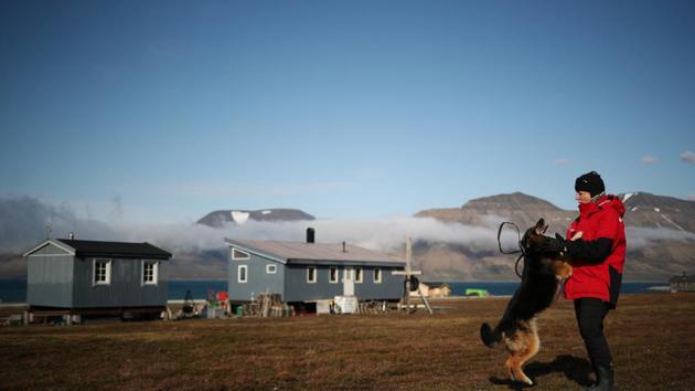 Erosion also threatens homes here. Three years ago, as winter approached, 13 meters of coastline fell away overnight, leaving Christiane Huebner’s cabin perilously close to the fjord. Huebner, her family of three and their husky dogs abandoned the home. “It was a wake-up call since it happened very quickly,” she says. They returned the following spring and had to relocate the cabin 80 meters from the shore. (Hannah McKay / REUTERS) Erosion also threatens homes here. Three years ago, as winter approached, 13 meters of coastline fell away overnight, leaving Christiane Huebner’s cabin perilously close to the fjord. Huebner, her family of three and their husky dogs abandoned the home. “It was a wake-up call since it happened very quickly,” she says. They returned the following spring and had to relocate the cabin 80 meters from the shore. (Hannah McKay / REUTERS)
