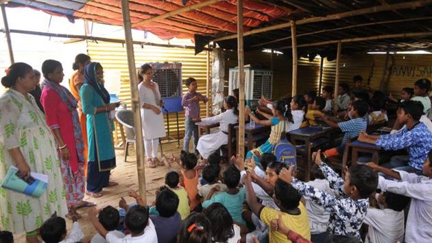 Pooja Sindhu’s class at a roadside school for the underprivileged near Butterfly Park(Parveen Kumar/HT Photo) Pooja Sindhu’s class at a roadside school for the underprivileged near Butterfly Park(Parveen Kumar/HT Photo)