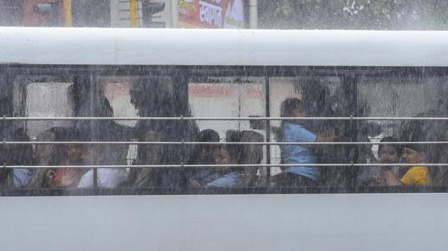 School kids look out from the window as it rain heavily at Andheri in Mumbai on Wednesday. (Vijayanand Gupta/HT Photo) School kids look out from the window as it rain heavily at Andheri in Mumbai on Wednesday. (Vijayanand Gupta/HT Photo)