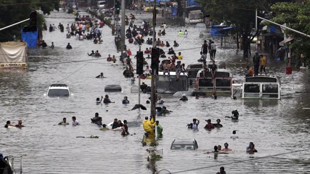 People wade through a flooded street following heavy monsoon rains at LBS road Kurla in Mumbai. The India Meteorological Department (IMD) has predicted heavy rains in several parts of the city and suburbs in the next 48 hours. “Mumbai most likely to get continuous rains and showers with the possibility of extremely heavy falls at isolated places in city and suburbs for the next 48 hours,” an IMD release read. (Kunal Patil / HT Photo) People wade through a flooded street following heavy monsoon rains at LBS road Kurla in Mumbai. The India Meteorological Department (IMD) has predicted heavy rains in several parts of the city and suburbs in the next 48 hours. “Mumbai most likely to get continuous rains and showers with the possibility of extremely heavy falls at isolated places in city and suburbs for the next 48 hours,” an IMD release read. (Kunal Patil / HT Photo)