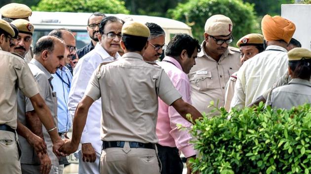 CBI Officials arrive with P Chidambaram at Rouse Avenue District Court Complex in New Delhi on Thursday. (ANI Photo) CBI Officials arrive with P Chidambaram at Rouse Avenue District Court Complex in New Delhi on Thursday. (ANI Photo)