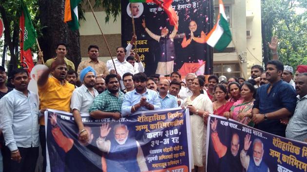 Pune Bharatiya Janata Party workers celebrate the abrogation of Article 370 at city BJP office off JM road in Pune, India, on Monday. (HT FILE PHOTO) Pune Bharatiya Janata Party workers celebrate the abrogation of Article 370 at city BJP office off JM road in Pune, India, on Monday. (HT FILE PHOTO)
