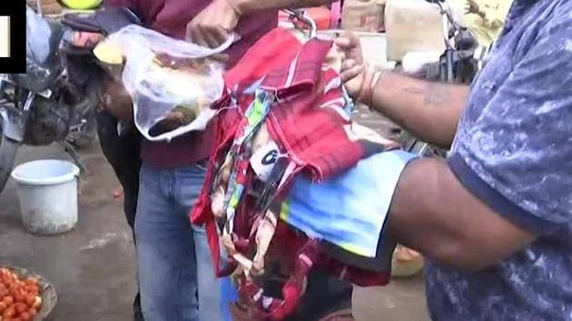 Bairagi family distributing free reusable bags in a market. (Twitter/@ANI) Bairagi family distributing free reusable bags in a market. (Twitter/@ANI)