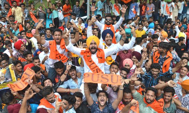 Panjab University Student Union alliance presidential candidate Gurjinder Singh celebrating his victory with his supporters at Post Graduate Government College, Sector 11, in Chandigarh on Friday.(Anil Dayal/HT)