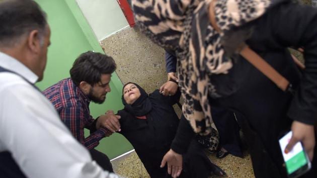 A woman weeps for relatives impacted by a suicide attack, as she is supported at the Wazir Akbar Khan hospital following the blast in Kabul, Afghanistan. The Taliban killed at least five people in a bombing in Kabul in yet another horrific attack as the US and the insurgents negotiate a deal to see American troops leave the country. (Wakil Kohsar / AFP) 