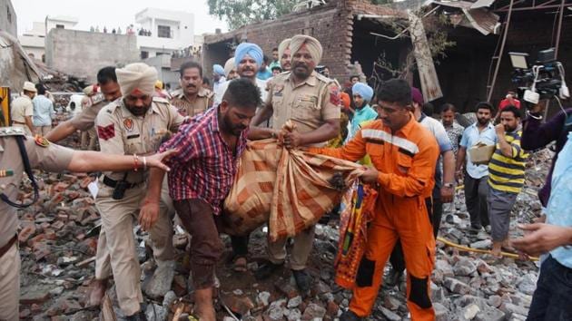 A day after the blast at a firecracker-manufacturing unit in Batala that killed 23 people and injured 27, police on Thursday said the unit was running illegally from the residential area as its licence had expired in 2016. . (Photo by Sameer Sehgal/ Hindustan Times )