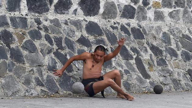 “There are some basic fundamentals in the indigenous worldview: the unity of our physical, intellectual, emotional and energetic beings. A lot of times, when people lose their way, it’s because they don’t have that unity. We help find it again,” said Lia Membrillo, coordinator at the cultural center. Giovanni Navarro, takes issue with the idea that he and his fellow players are “rescuing” ulama. Actually, the game is rescuing us,” he said. (Rocio Vazquez / AFP) 