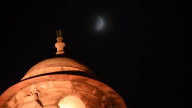 A view of the half moon in the night sky seen from Rajpath in New Delhi on Friday. The Chandrayaan-2 lunar mission will soft-land on the surface of the moon with the Vikram rover tonight.(Photo by Raj K Raj / Hindustan Times)