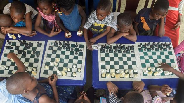 Children sit under a canopy as they play during a chess class at Ogolonto in Ikorodu district of Lagos. Chess -- a board game famous for its reliance on strategy -- has a tiny but avid following in Nigeria. The West African nation ranks 88th out of 186 countries, according to the FIDE World Chess Federation’s rating of top players across the globe, but still does not have any Grandmasters. (Pius Utomi Ekpei/ AFP) Children sit under a canopy as they play during a chess class at Ogolonto in Ikorodu district of Lagos. Chess -- a board game famous for its reliance on strategy -- has a tiny but avid following in Nigeria. The West African nation ranks 88th out of 186 countries, according to the FIDE World Chess Federation’s rating of top players across the globe, but still does not have any Grandmasters. (Pius Utomi Ekpei/ AFP)