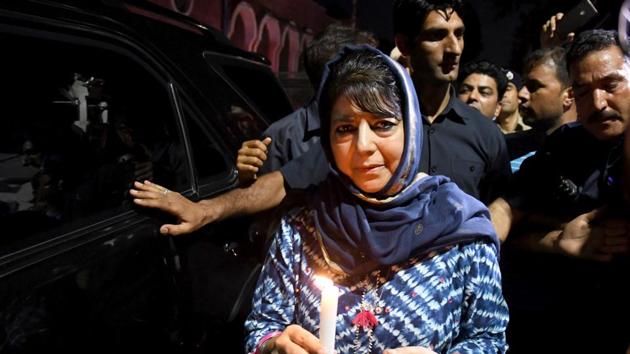 Former Chief Minister of Jammu and Kashmir and PDP leader Mehbooba Mufti during a candle march protest in Srinagar on August 4, a day before she was detained by the Centre.(ANI Photo)