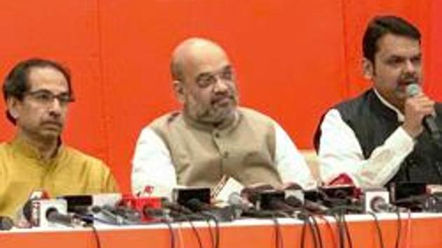 Maharashtra Chief Minister Devendra Fadnavis with BJP President Amit Shah and Shiv Sena leader Uddhav Thackeray.(PTI Photo)