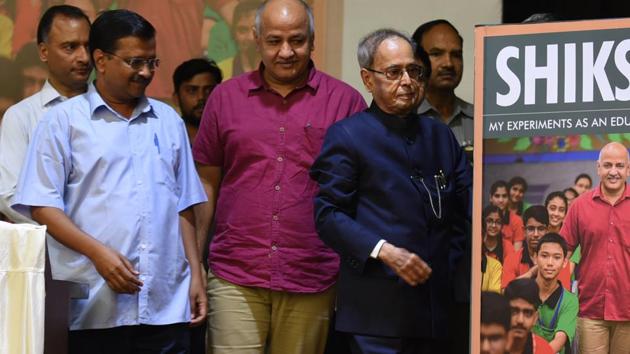 Delhi Chief Minister Arvind Kejriwal, Deputy Chief Minister Manish Sisodia and former President Pranab Mukherjee during the release of Sisodia’s book ‘Shiksha,’ at NDMC Convention Centre, in New Delhi, India, on Thursday, (Raj K Raj/HT PHOTO) Delhi Chief Minister Arvind Kejriwal, Deputy Chief Minister Manish Sisodia and former President Pranab Mukherjee during the release of Sisodia’s book ‘Shiksha,’ at NDMC Convention Centre, in New Delhi, India, on Thursday, (Raj K Raj/HT PHOTO)