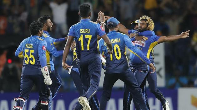 Sri Lanka's Lasith Malinga, facing camera, celebrates taking a hat trick wicket.(AP)