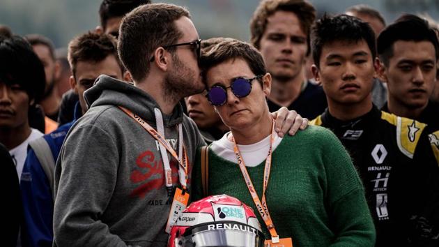 Brother and mother of BWT Arden’s French driver Anthoine Hubert observe a minute’s silence before the start of the Formula3 race  , at the Spa-Francorchamps circuit in Spa the day of the Belgian Formula One Grand Prix. Hubert, 22, was killed on August 31 in Spa in an accident during a Formula 2 race held on the sidelines of the F1 Grand Prix. (Kenzo Tribouillard / AFP) 