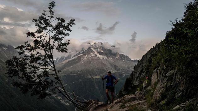 A trailer competes in the 170 km Mount Blanc Ultra Trail (UTMB) race around the Mont-Blanc crossing France, Italy and Switzerland in the Tete aux Vents near Chamonix. (Jeff Pachoud / AFP) 