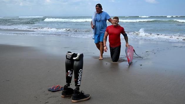 Jade Wheatley from Australia takes part in the Bali Adaptive Pro, an international contest for surfers with disabilities, at Canggu beach on Indonesia’s resort island of Bali. (Sonny Tumbelaka / AFP) 