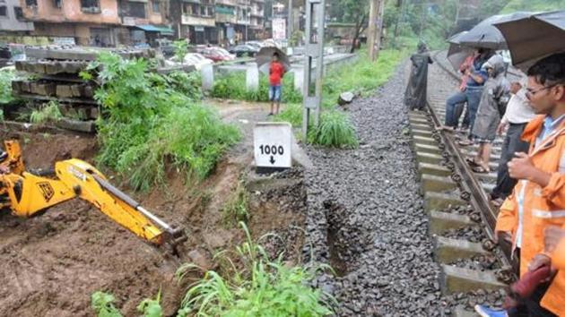 Mudslide between Belapur and Targhar led to local services on Belapur-Kharkopar line being suspended for the entire day on Wednesday, affecting more than 7,000 commuters who travel on the route.(Hindustan Times) Mudslide between Belapur and Targhar led to local services on Belapur-Kharkopar line being suspended for the entire day on Wednesday, affecting more than 7,000 commuters who travel on the route.(Hindustan Times)