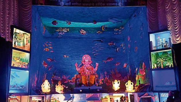 Although most Ganesh mandals have a low-key celebration this year because of floods in Sangli and Kolhapur, they are highlighting many civic problems and social issues. (ht photo: praful gangurde) Although most Ganesh mandals have a low-key celebration this year because of floods in Sangli and Kolhapur, they are highlighting many civic problems and social issues. (ht photo: praful gangurde)
