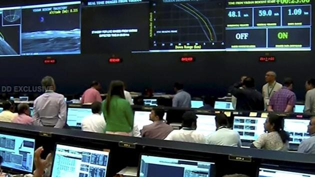 Officials watch live telecast of the soft landing of Vikram module of Chandrayaan 2 on lunar surface as it starts 'fine breaking' at ISRO Telemetry Tracking and Command Network (ISTRAC), in Bengaluru, Saturday, Sept. 7, 2019.(PTI)