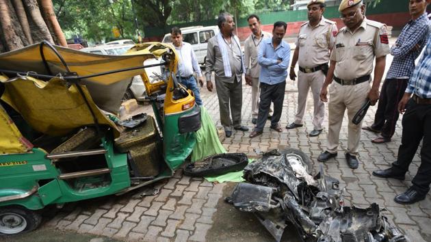 The mangled remains of an auto-rickshaw and scooter after a dumper truck ran over auto rickshaws, a scooter and pedestrians on Man Singh Road near India Gate, in New Delhi. Two people died and two were injured in the incident. (Arvind Yadav / HT Photo) The mangled remains of an auto-rickshaw and scooter after a dumper truck ran over auto rickshaws, a scooter and pedestrians on Man Singh Road near India Gate, in New Delhi. Two people died and two were injured in the incident. (Arvind Yadav / HT Photo)