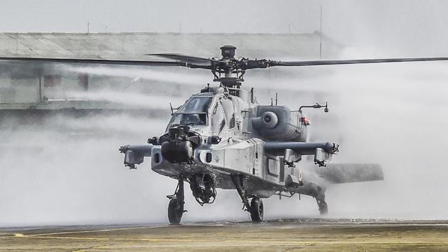 The US-made Apache AH-64E attack helicopter being accorded water salute during its induction ceremony into the Indian Air Force, at Airforce Station, Pathankot, Punjab. Eight US-made Apache AH-64E attack helicopters have been inducted into the IAF. (Manvender Vashist / PTI) The US-made Apache AH-64E attack helicopter being accorded water salute during its induction ceremony into the Indian Air Force, at Airforce Station, Pathankot, Punjab. Eight US-made Apache AH-64E attack helicopters have been inducted into the IAF. (Manvender Vashist / PTI)